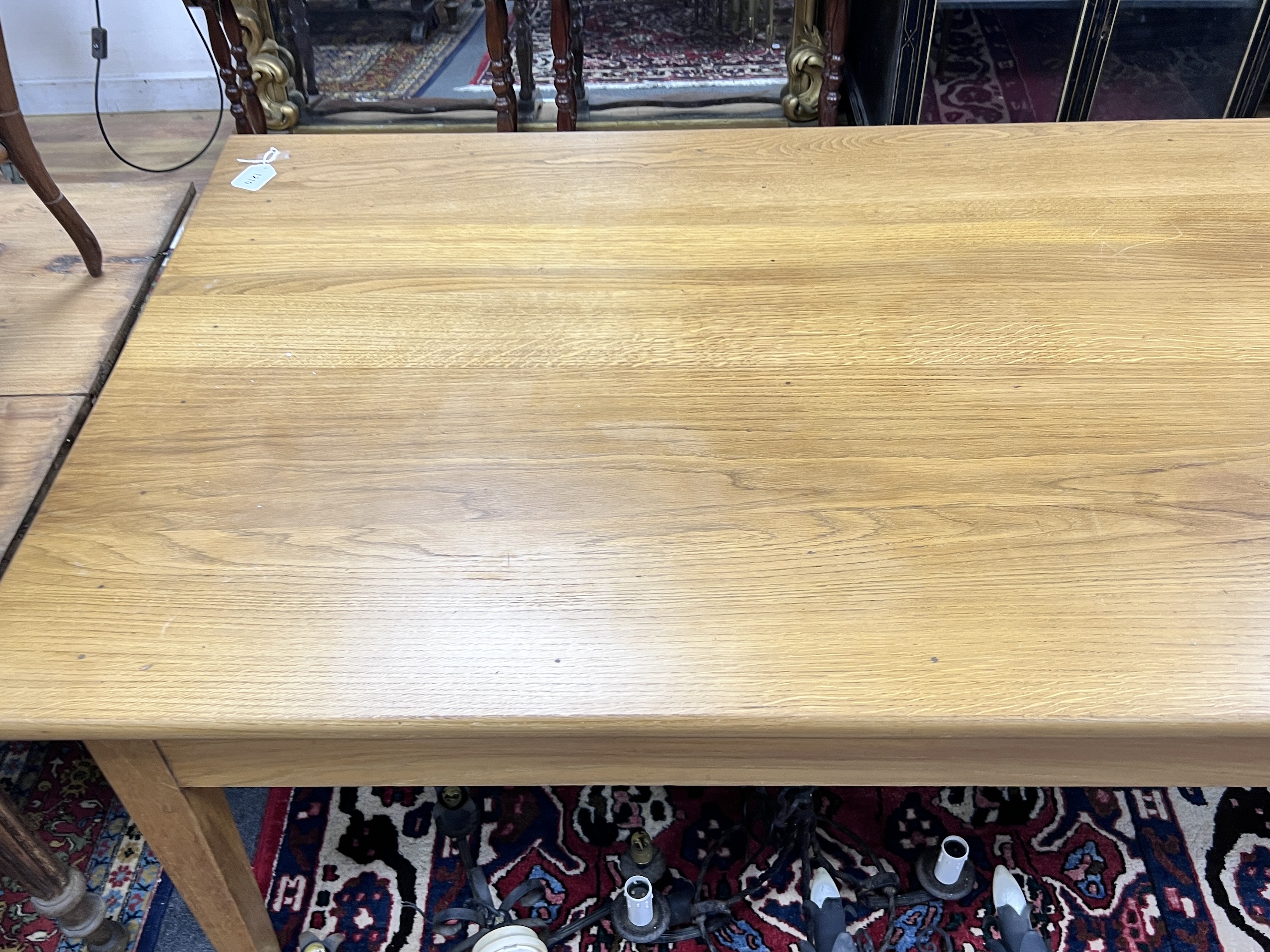 A contemporary oak refectory style dining table, length 200cm, width 89cm, height 72cm